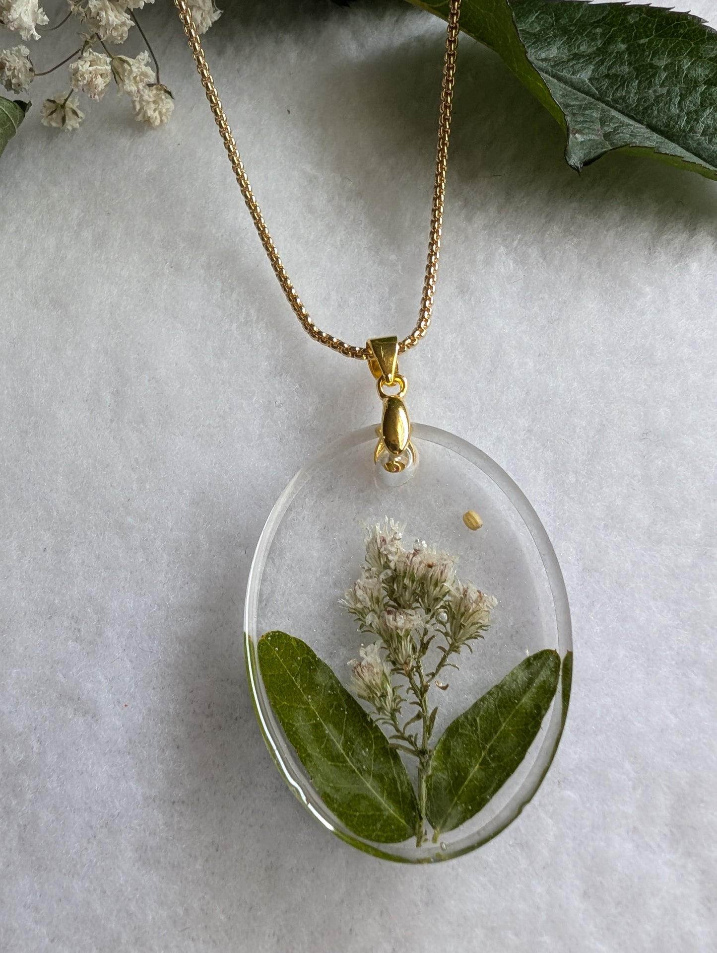 Large embellished floral oval pendant with gold long chain
