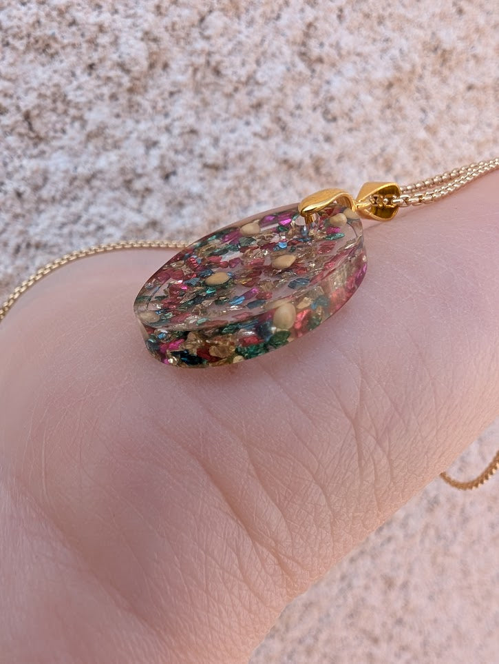 multicolored oval mustard seed necklace with gold colored adjustable chain