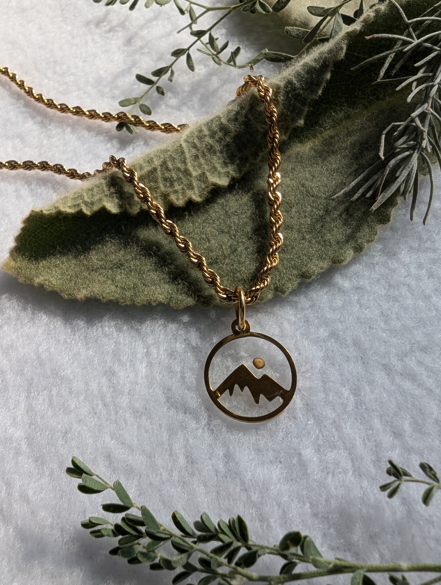 Gold mountain mustard seed pendant with gold plated rope chain