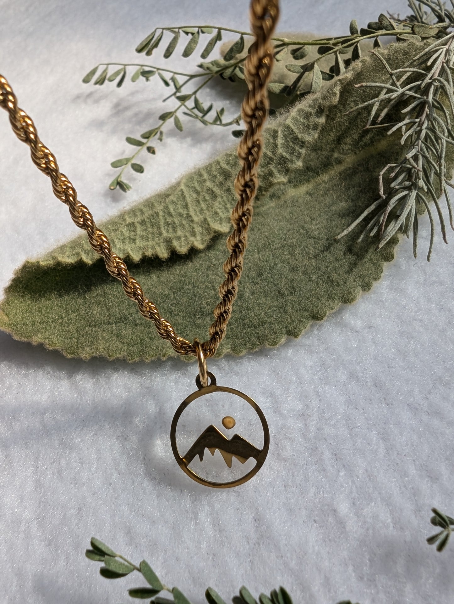 Gold mountain mustard seed pendant with gold plated rope chain