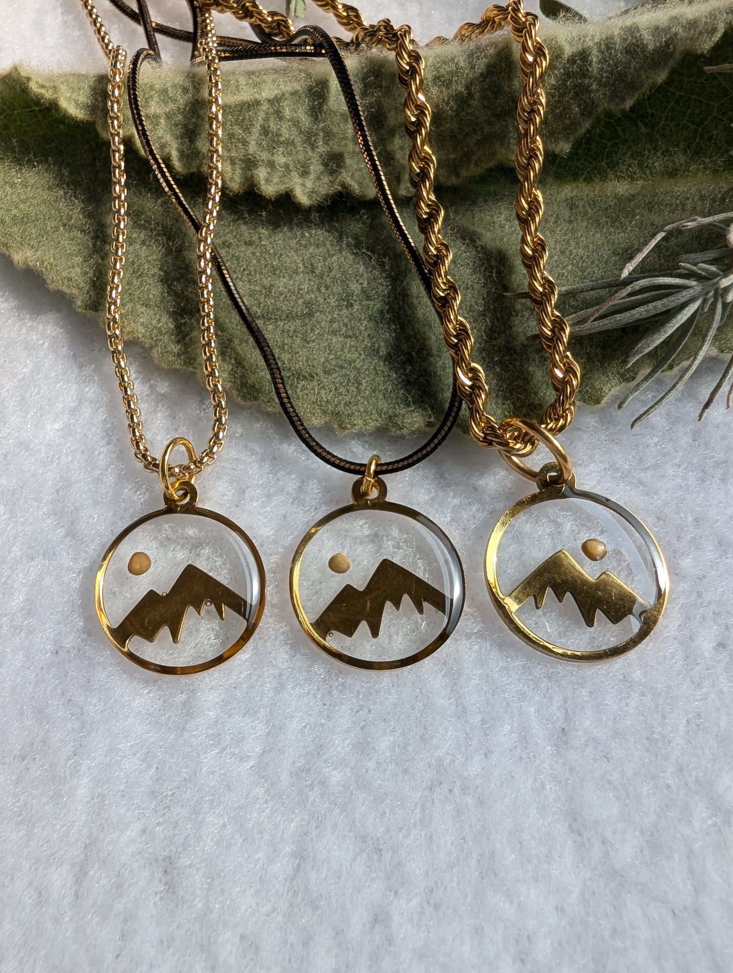 Gold mountain mustard seed pendant with gold plated rope chain